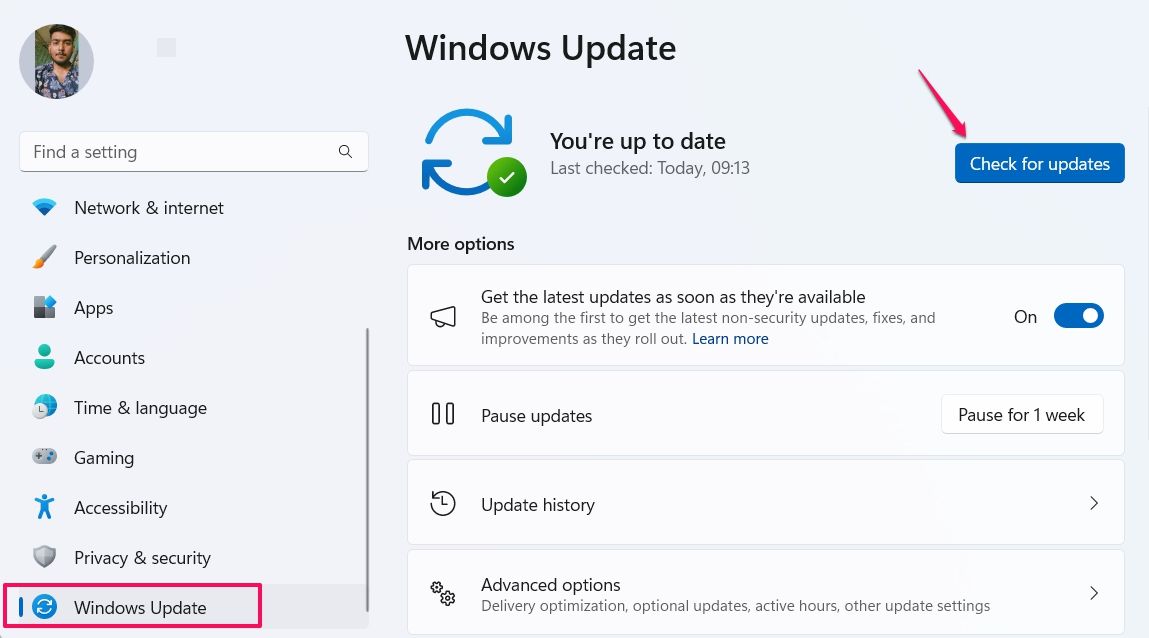 The Windows update menu in the Settings app with an arrow pointing to the Check for Updates button.