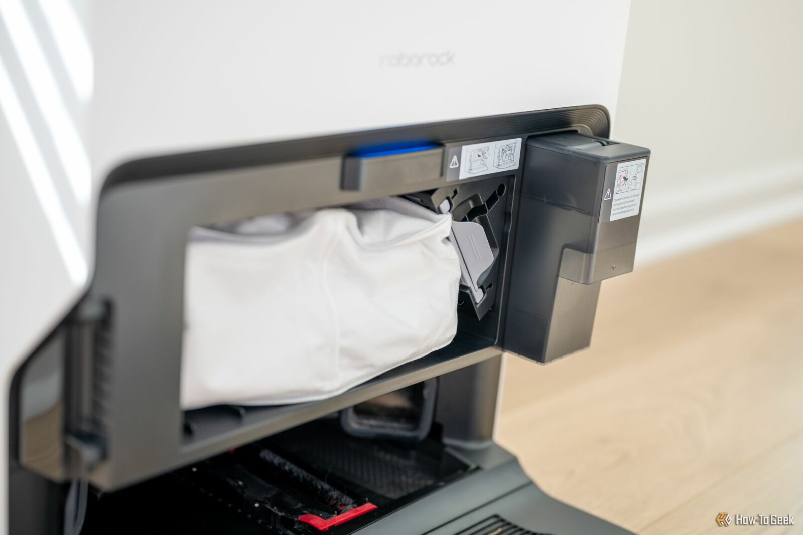 Debris bag and cleaning solution container inside the Roborock S8 MaxV Ultra self emptying docking station